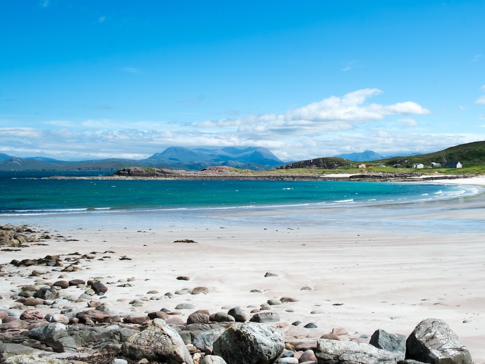 a picture of a white sand beach in scotland