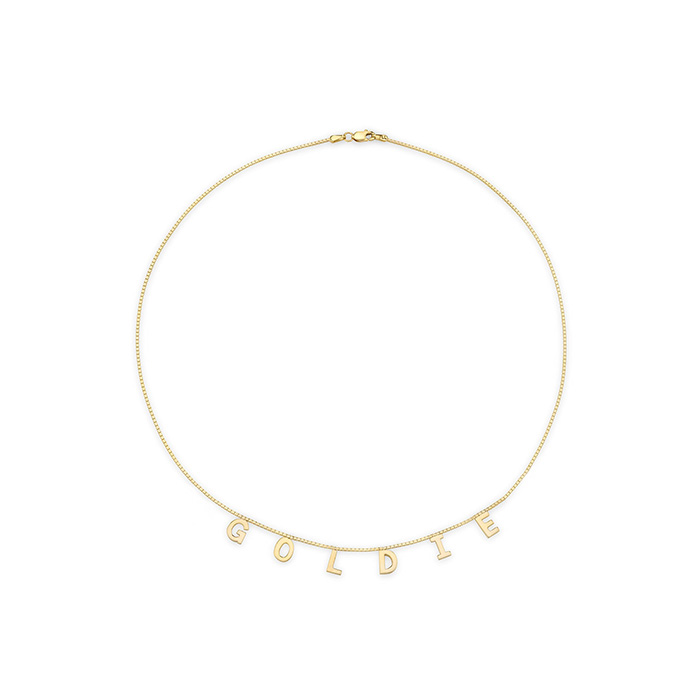 yellow gold personalized necklace reading "goldie"