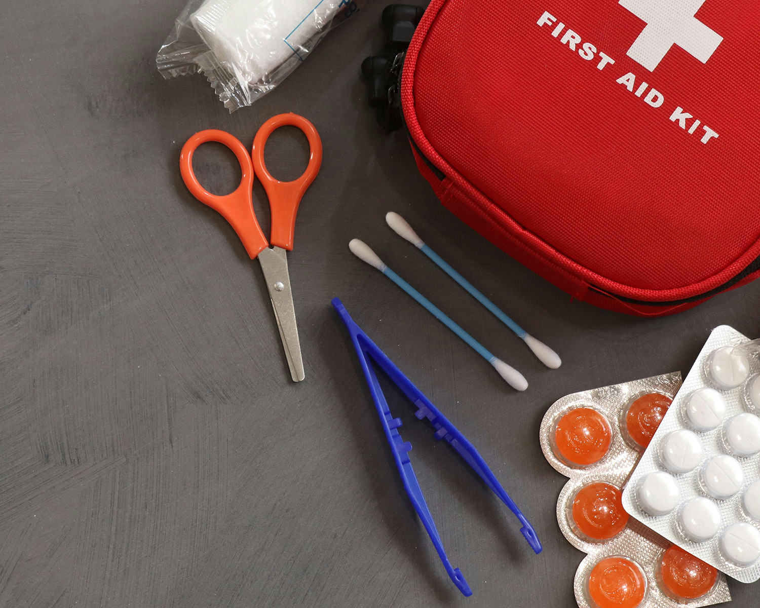 First aid kid with bandages and scissors 