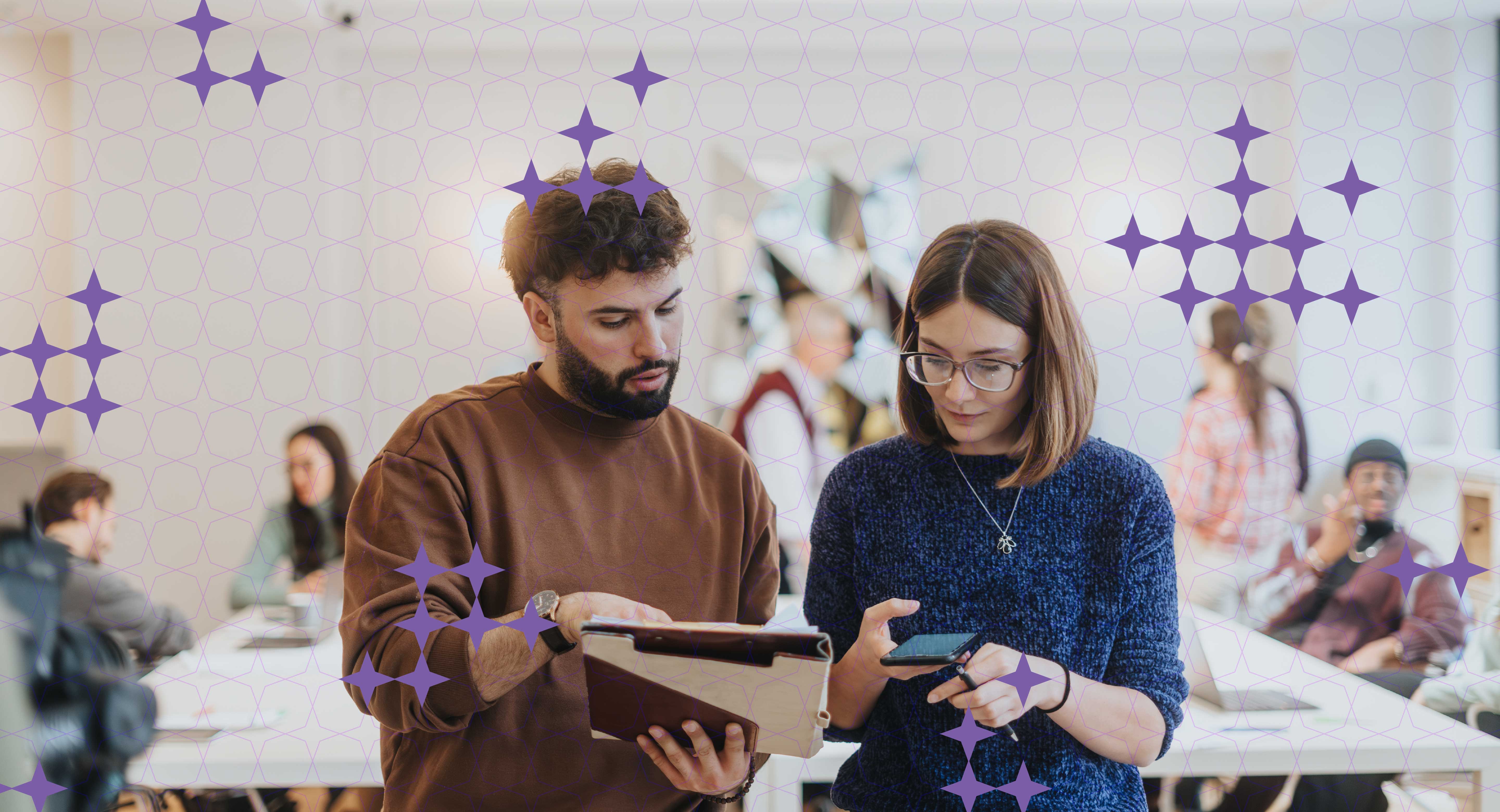 Two people discuss something in an office setting.