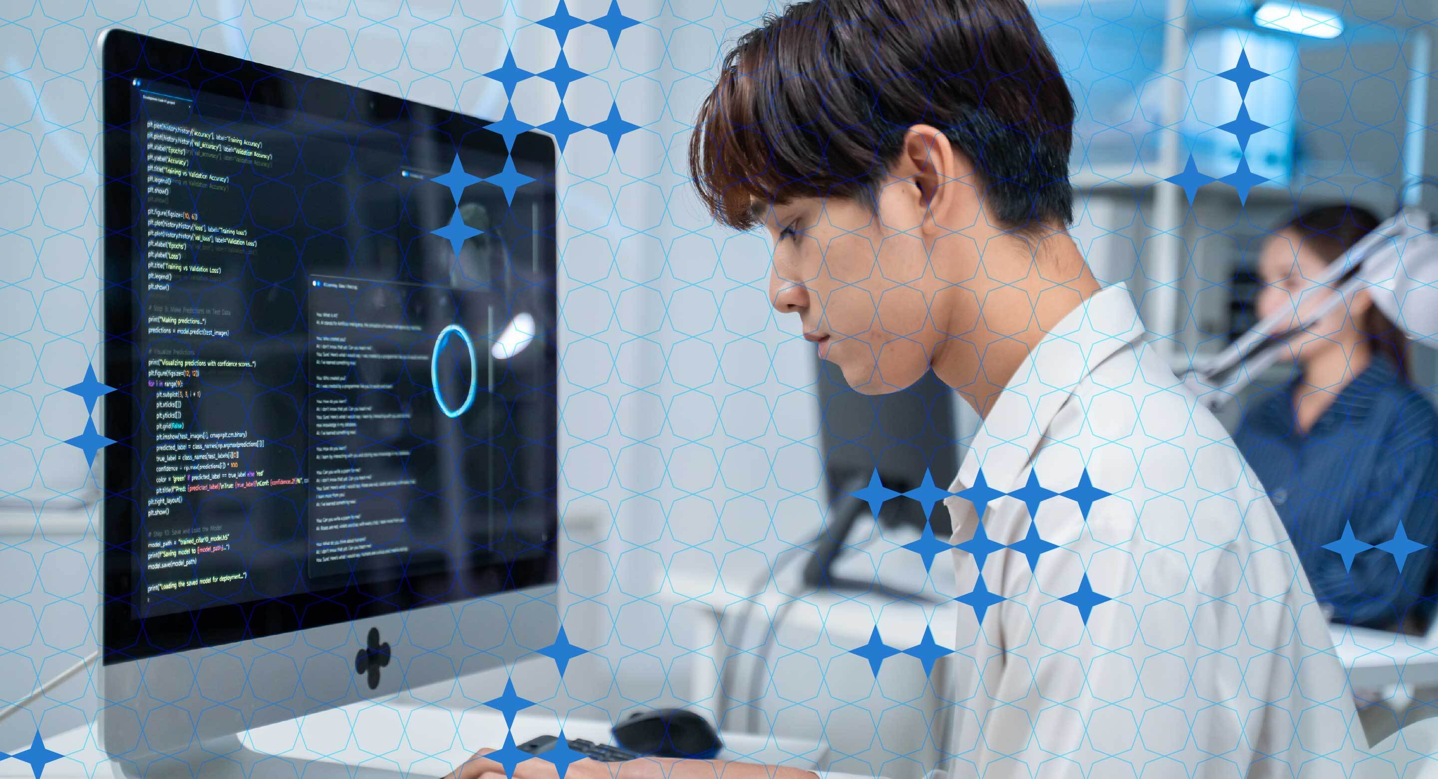 A person works at a computer in an austere environment