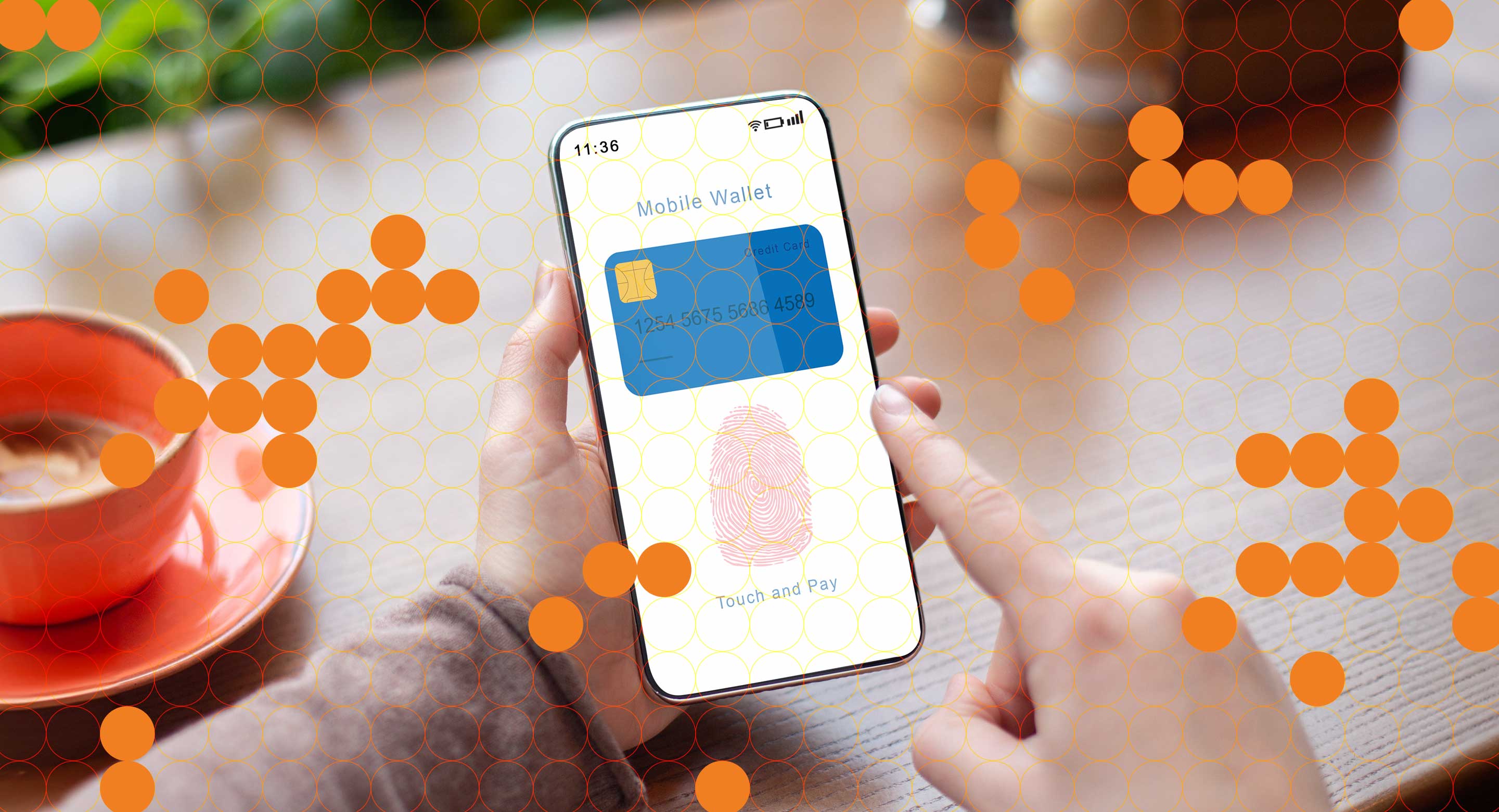 A photo of a person using a mobile wallet in a cafe
