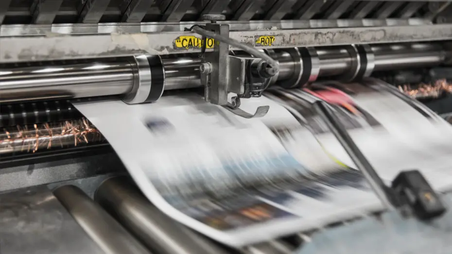Newspapers being printed in commercial press