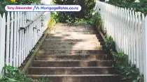 Stairs with white picket fences