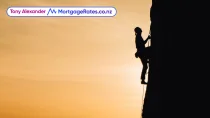 Silhouette of person climbing mountain