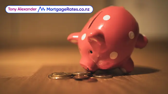 Piggy bank with coins on table