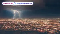 Zoomed out shot of a city, lightning strike