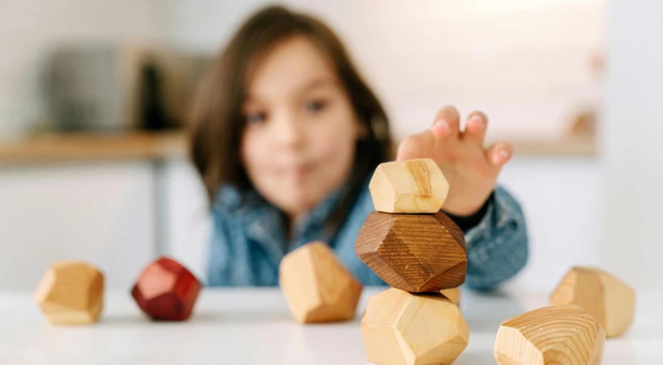 Child stacking building blocks