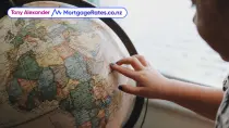 Young girl looking at a globe
