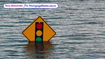 Stop sign in flood waters
