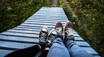 Two pairs of feet resting