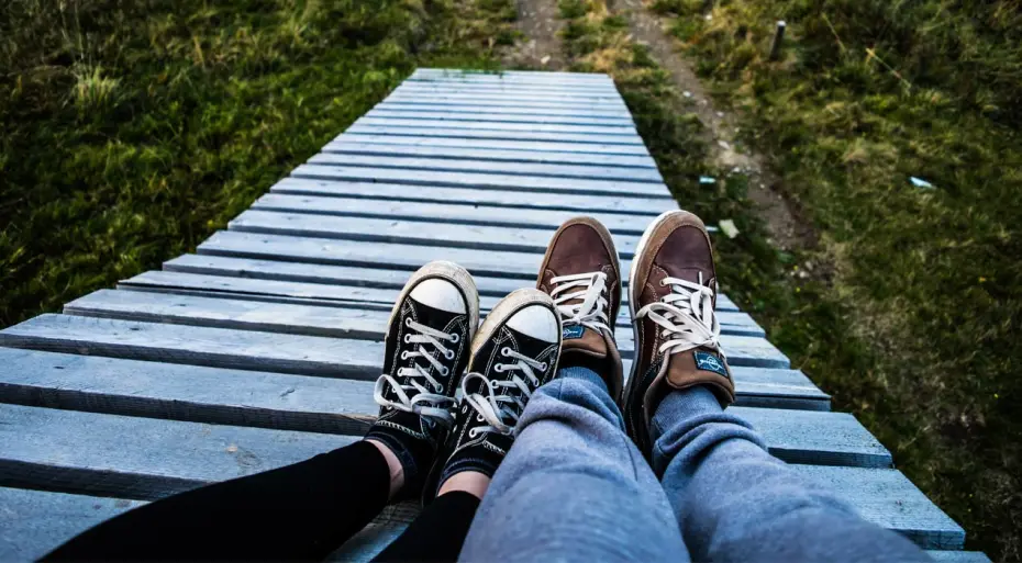 Two pairs of feet resting