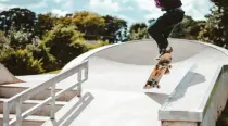 Young man skateboarding in a skate park