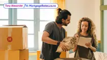 Young couple with moving boxes in house