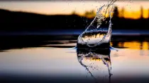 Water dropping in front of sunset