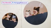 Four kids peeking outside playhouse cautiously