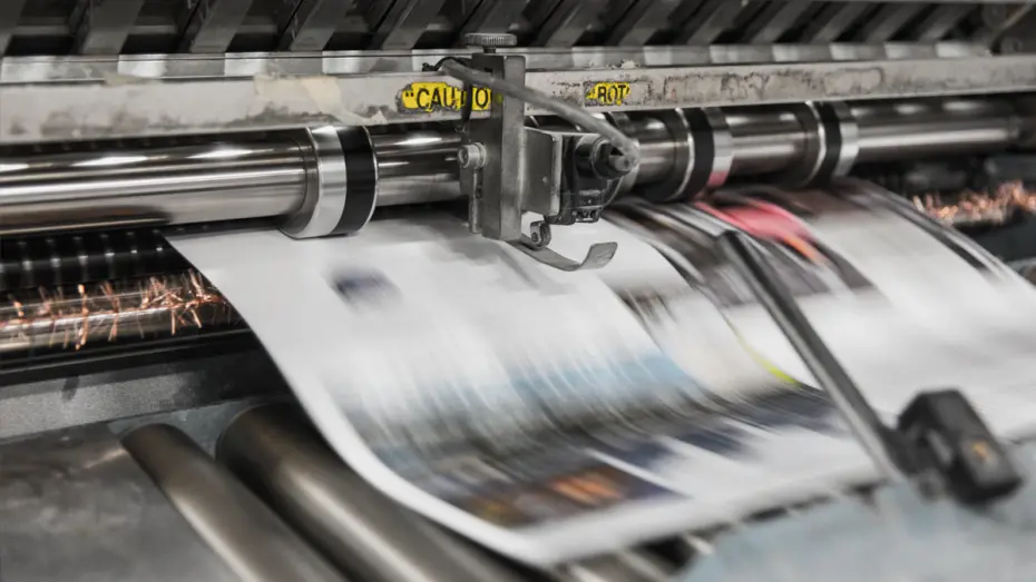 Newspapers being printed on a commercial printer