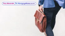 Back of business person walking with briefcase