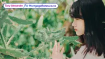 Girl touching thorny cactus