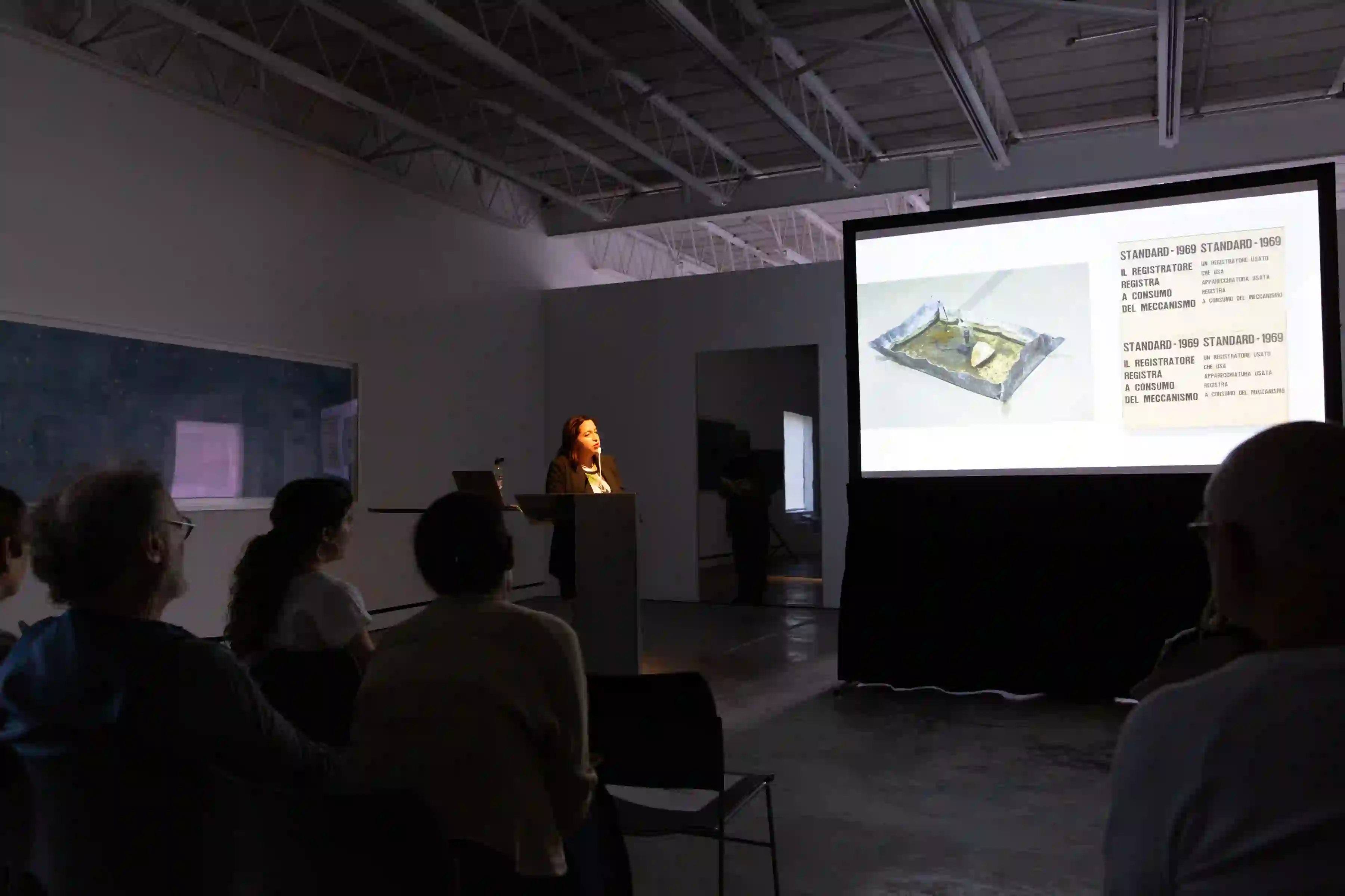 Photo of John Alchin and Hal Marryatt Associate Curator of Contemporary Art, Philadelphia Museum of Art, Erica F. Battle, giving her lecture "Recasting the Past: Amalfi ’68 and the Spaces between Exhibition and History," on June 15, 2019
