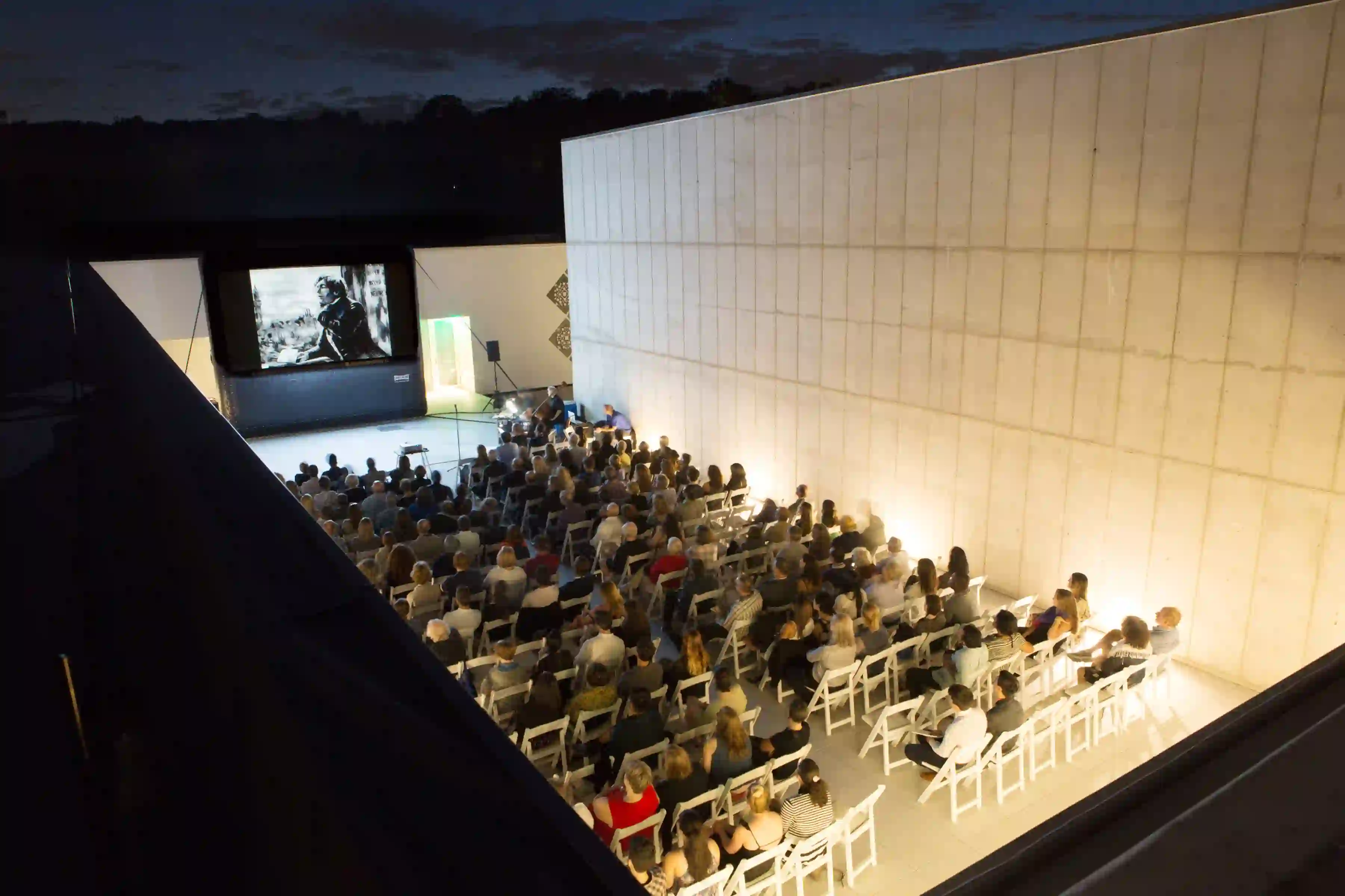 Aerial view of Magazzino Italian Art's inaugural event, an outdoor screening of "NYsferatu: Symphony of a Century" by Italian artist Andrea Mastrovito