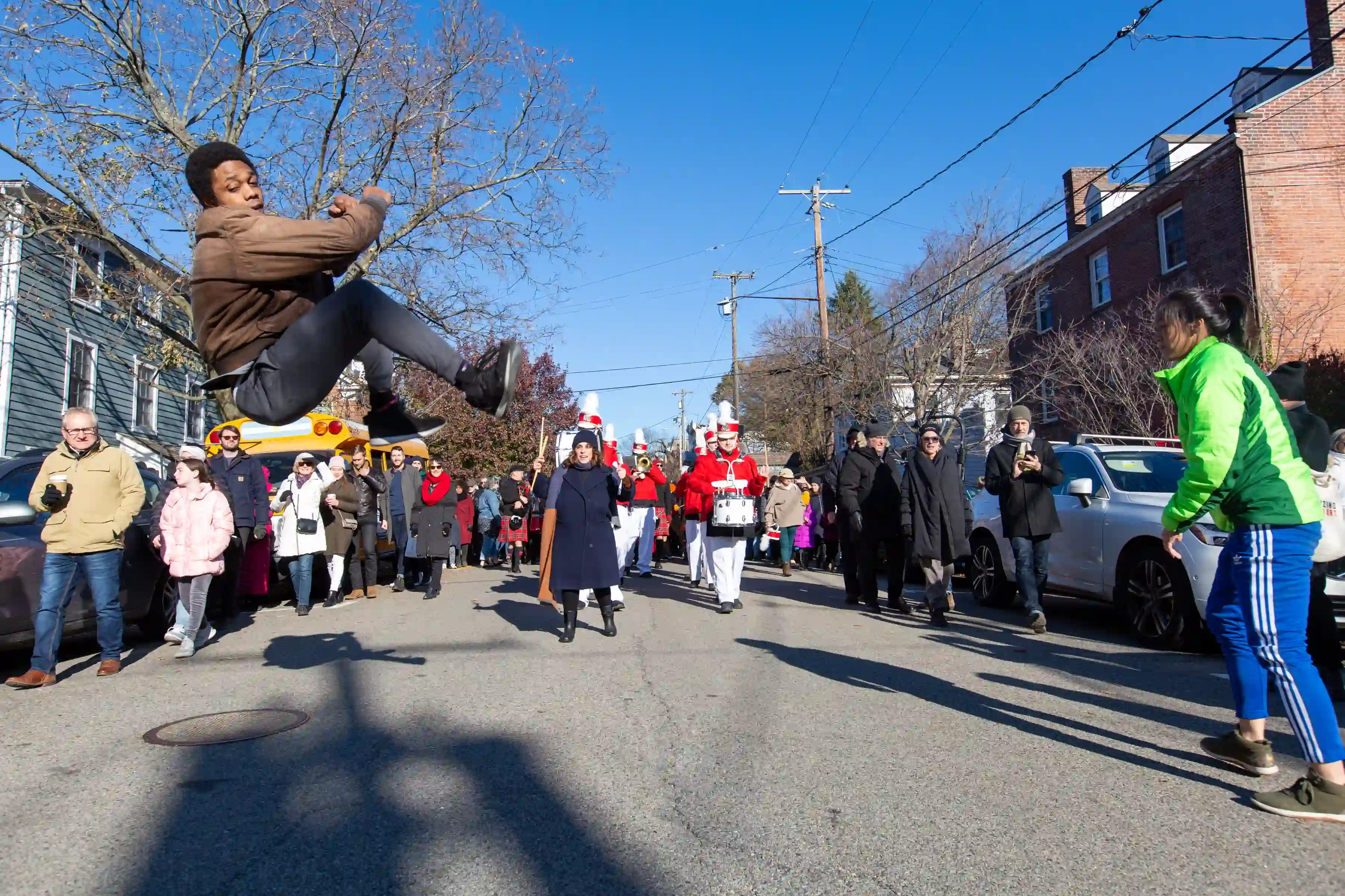 Performer flipping mid-air at the Marinella Senatore and The School of Narrative Dance Performance event, 2019