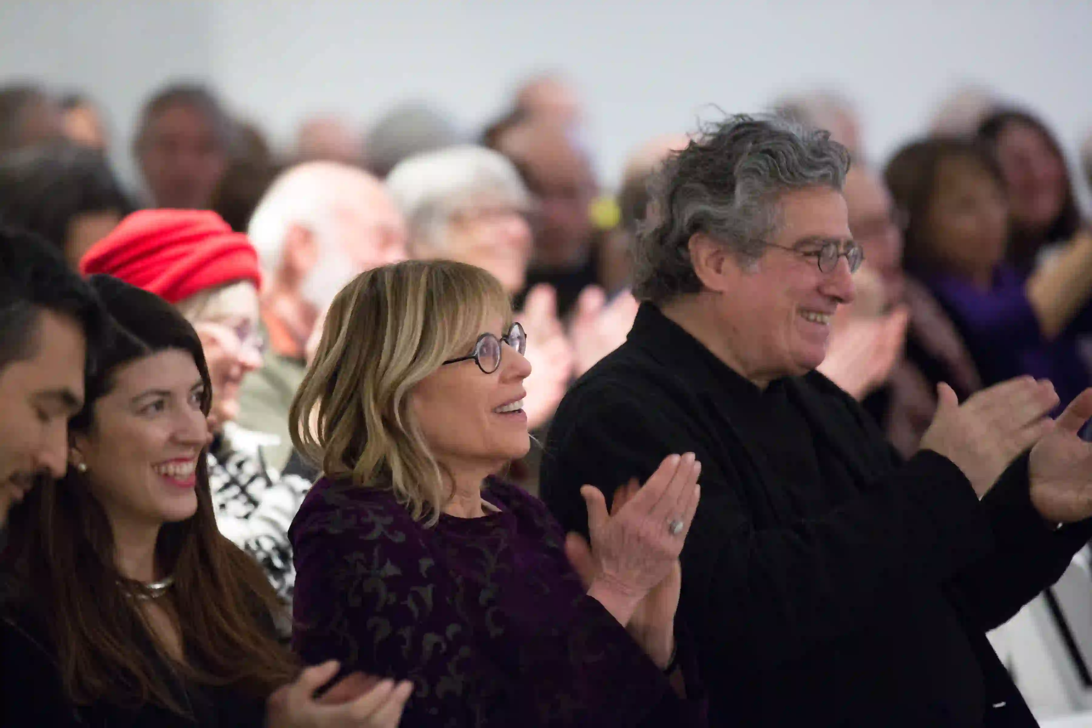 Co-founders Nancy Olnick and Giorgio Spanu applauding The Brasiles Ensemble