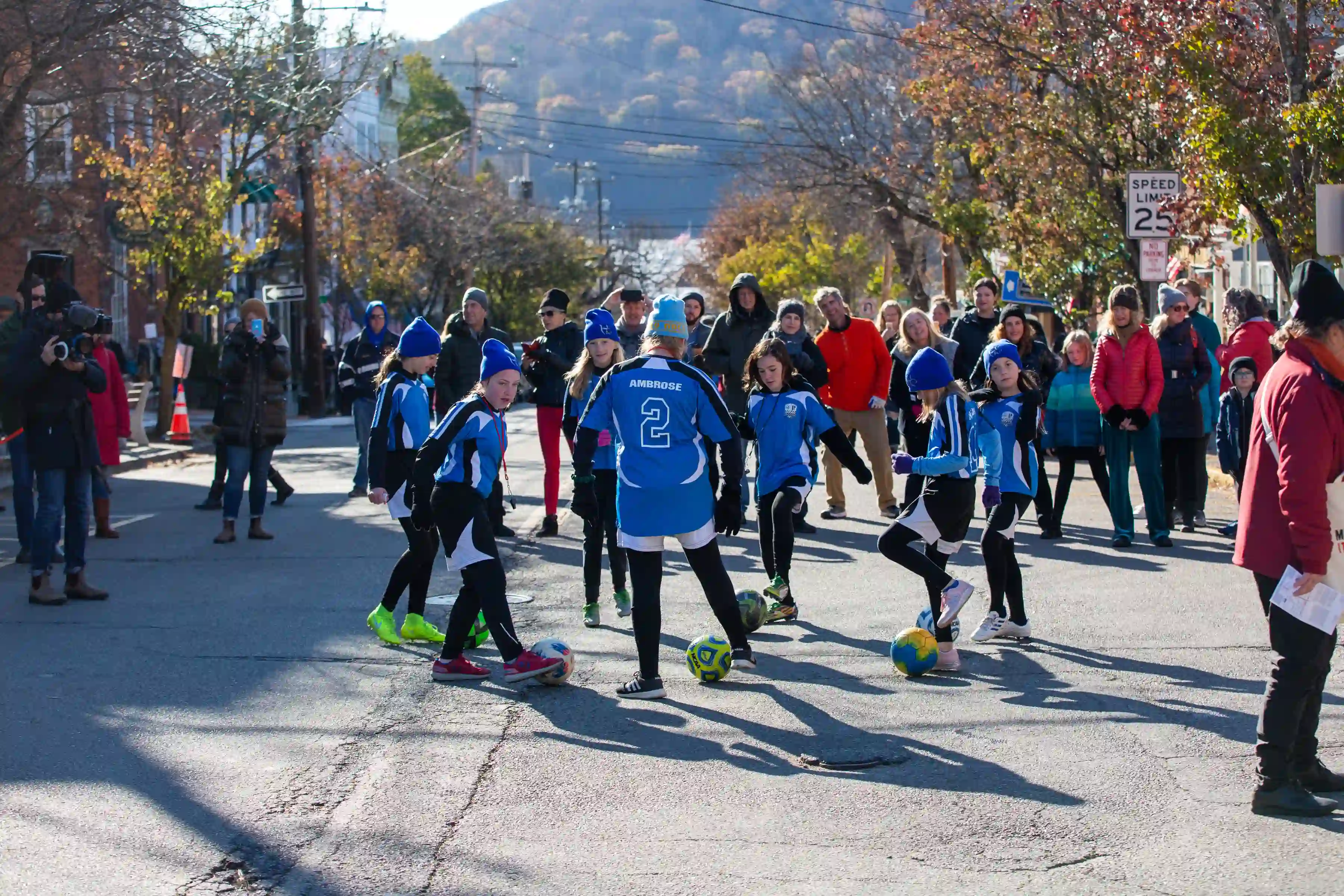 Kids playing soccer at the Marinella Senatore and The School of Narrative Dance Performance event, 2019