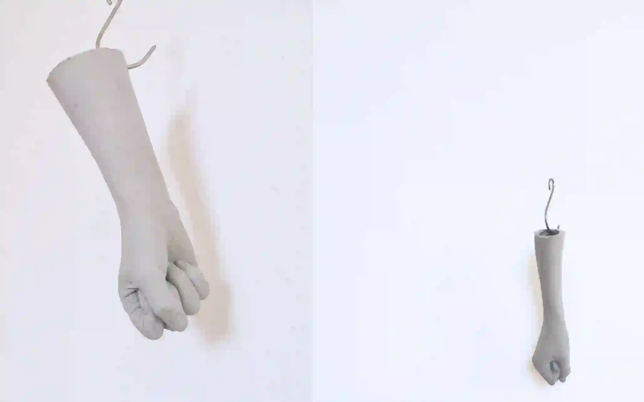 Still from video. Pensiero Plurale, On the Politics of Visibility (fist sculptures mounted on wall).
