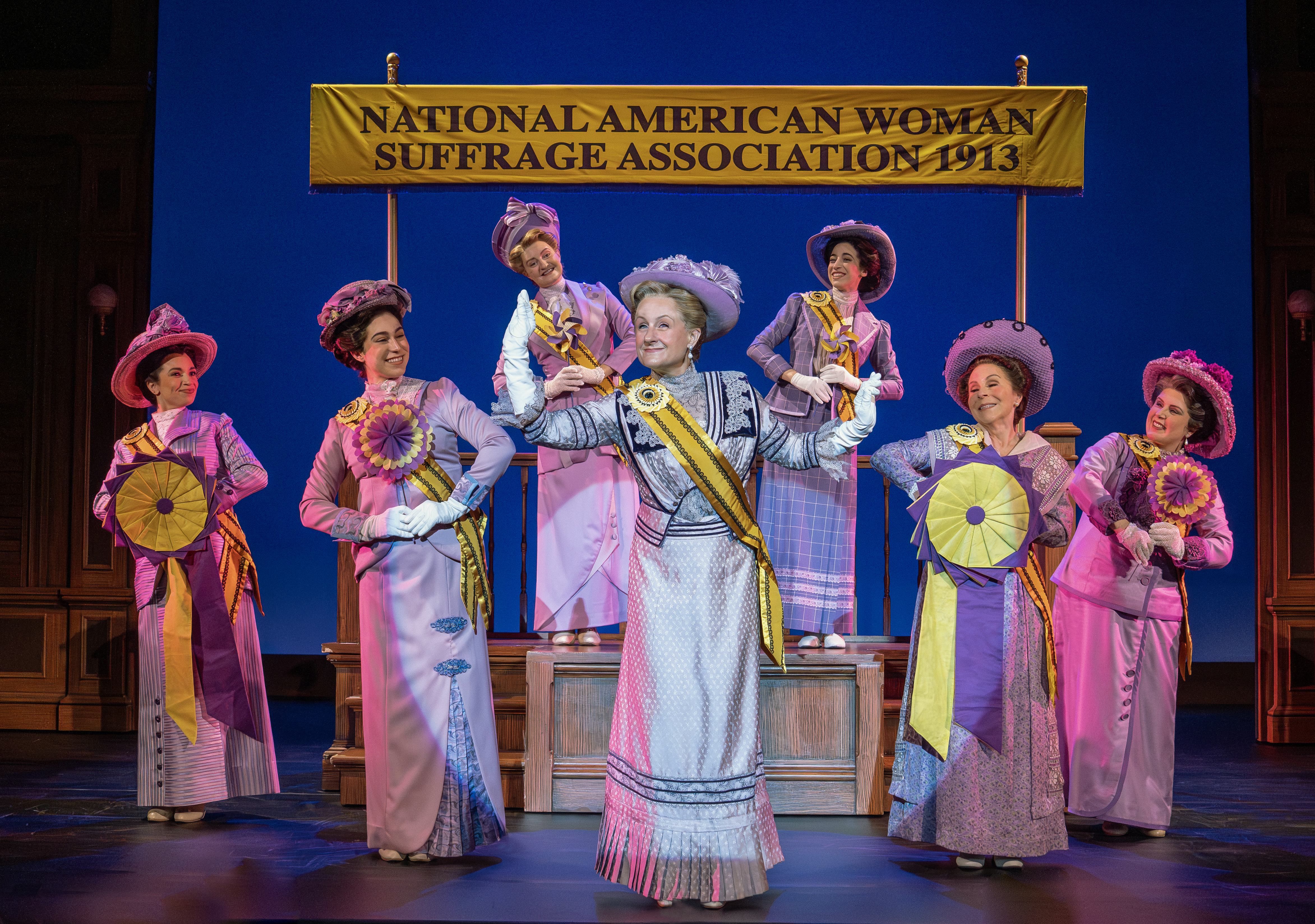 1 - Jenn Colella as Carrie Chapman Catt and Suffs Broadway Company Large