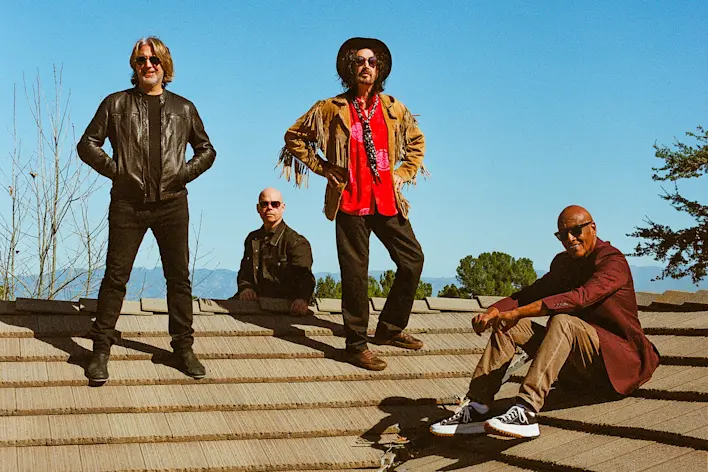 Image > Mike Campbell & The Dirty Knobs > band photo > rooftop