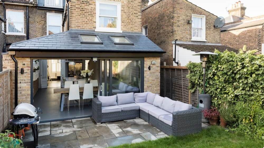 The exterior of a wraparound single storey extension in East Dulwich, London.