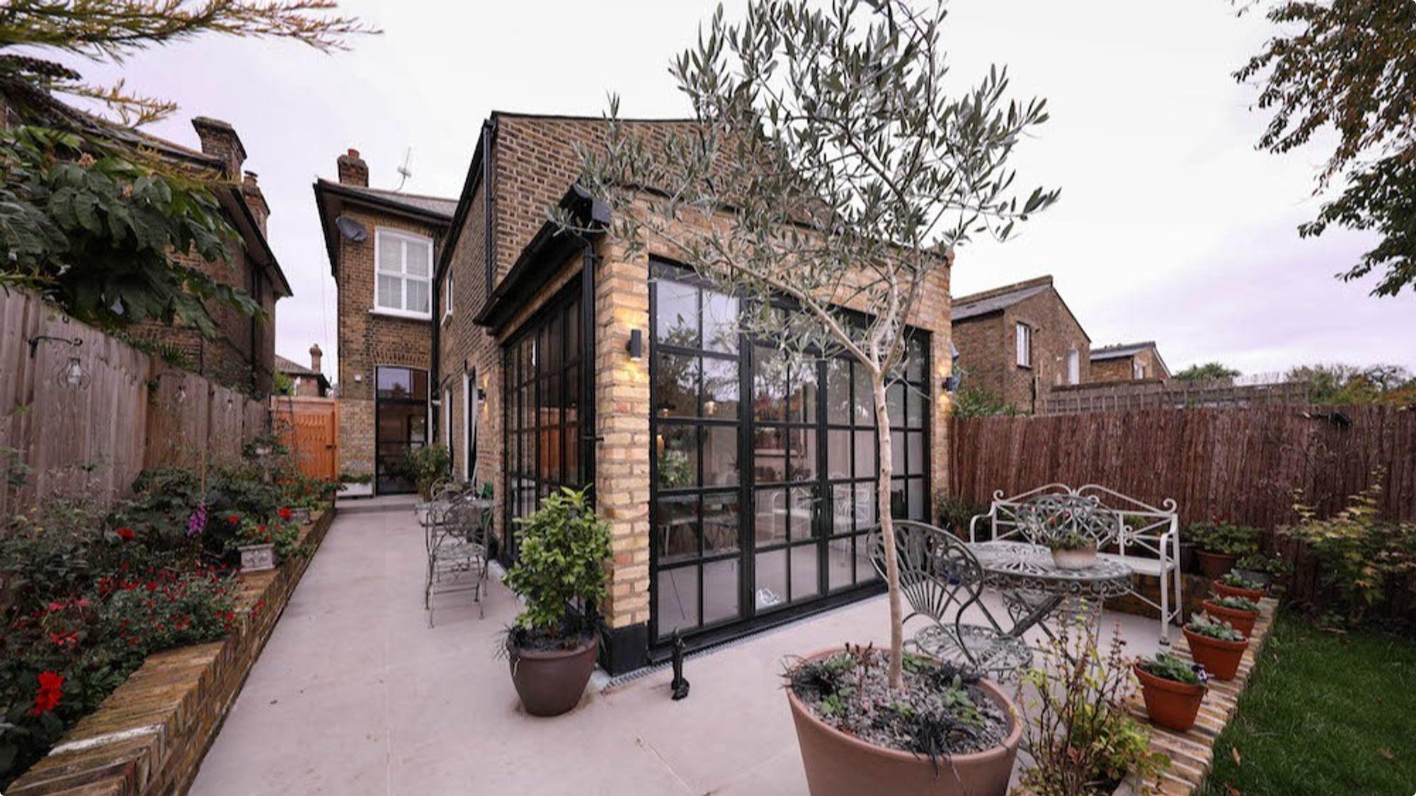 A modern rear single-storey extension, complete with stylish Crittall-style windows