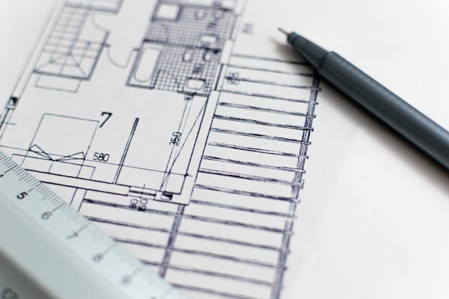 An Architect Drawing and Planning an Extension