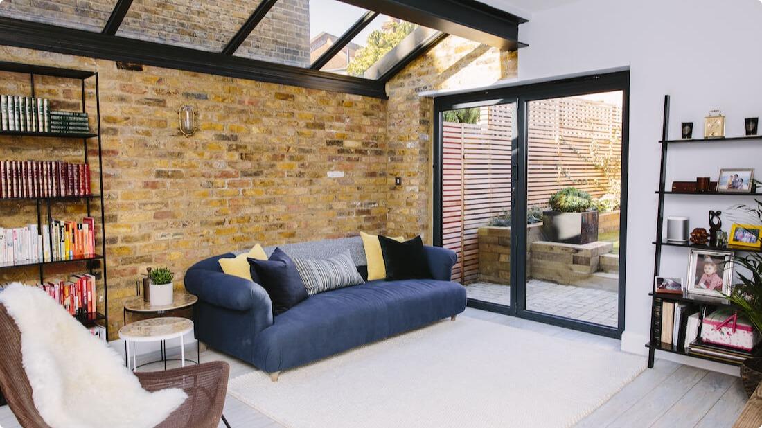 Single storey side extension with living room and exposed brick wall
