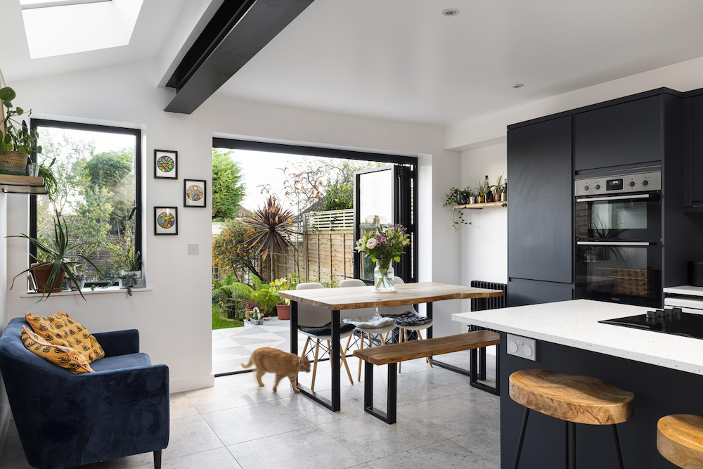 A completed open plan kitchen extension with a comfy chillout area and dining space