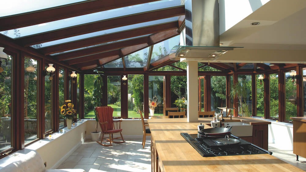 An open plan conservatory kitchen | Photo by Lizzie Benton