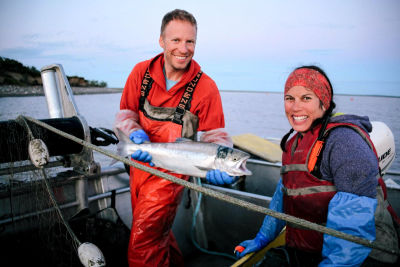 Iliamna Fish Co shows off a caught salmon