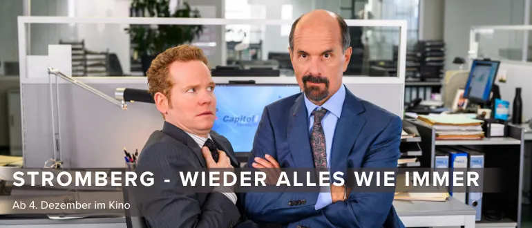 Hier sieht man Bernd Stromberg und einen Bürokollegen von ihm. Stromberg guckt selbstsicher in die Kamera, der Mitarbeiter ängstlich bzw. irritiert auf Stromberg.