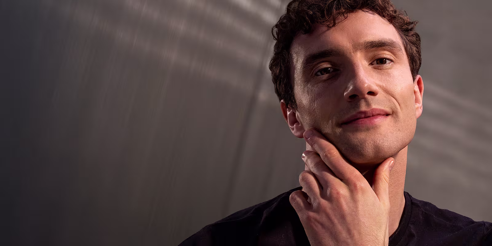 Man feeling his freshly shaved face.