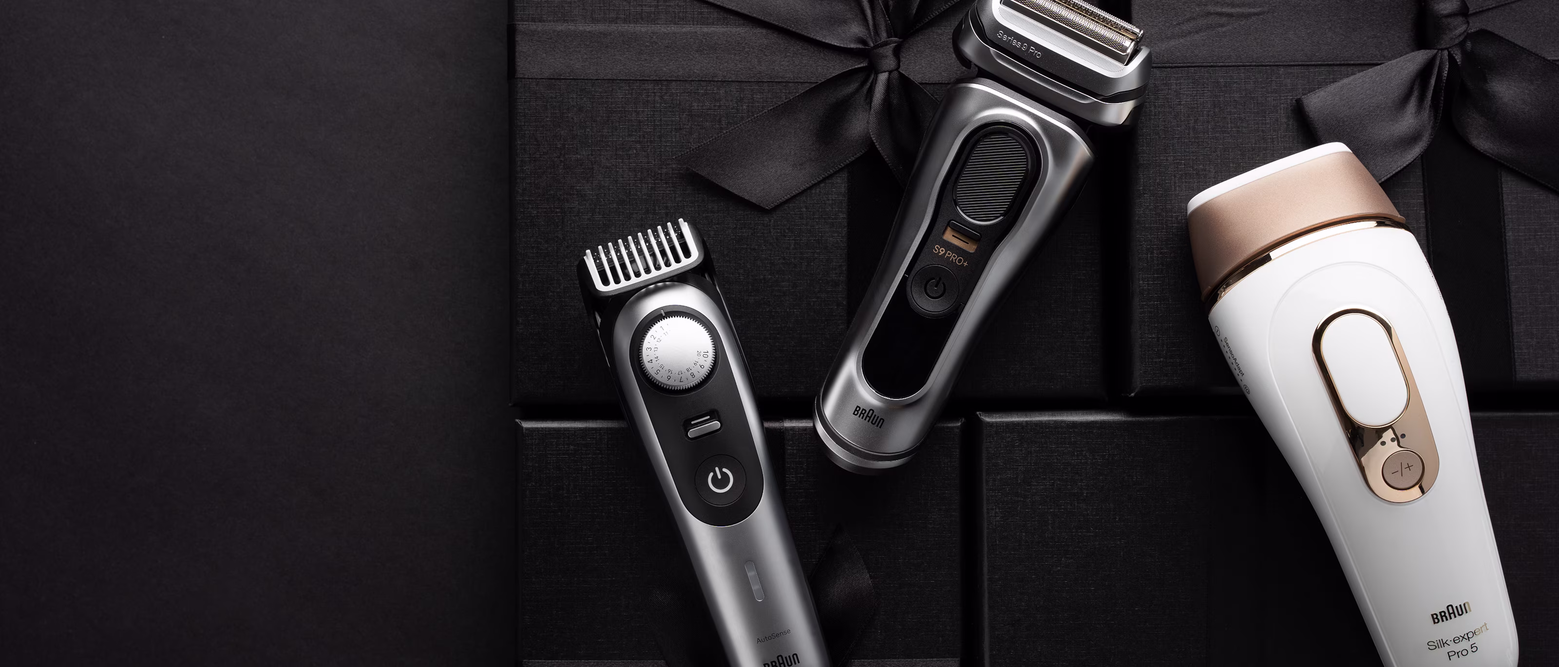 Braun trimmer and shaver on a tray with ribbon and flowers. Braun trimmer and shaver on a tray with ribbon and flowers.