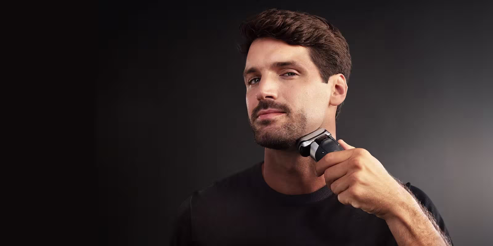 Man feeling his freshly shaved face. Man feeling his freshly shaved face.