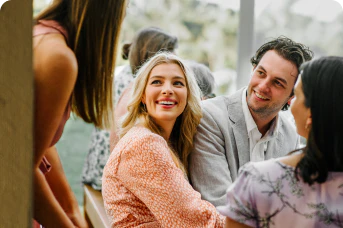 a group of people sitting and laughing