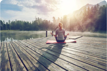 a person doing yoga on a dock