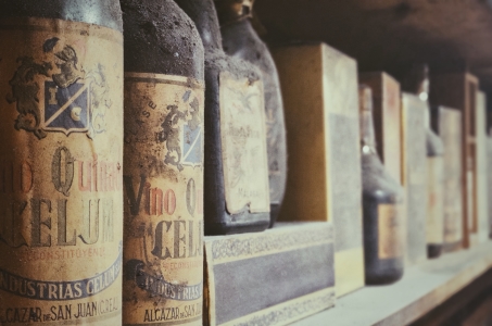 Dusty spanish wines on a shelf