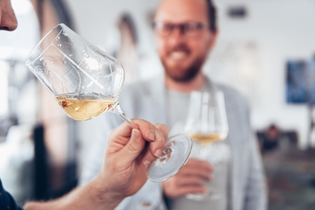 Men enjoying a French white wine