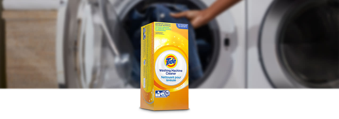 Tide Washing Machine Cleaner in front of a washing machine