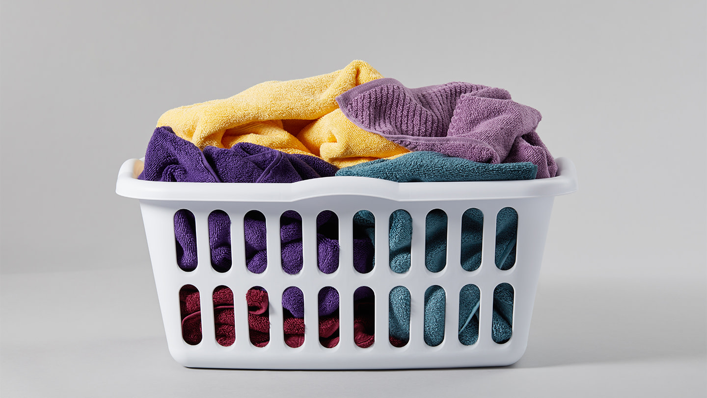 Colorful towels in a laundry basket