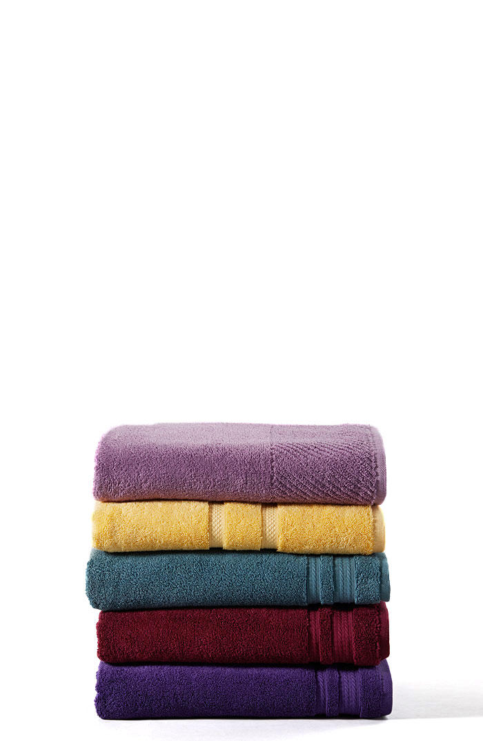 A pile of folded colorful towels