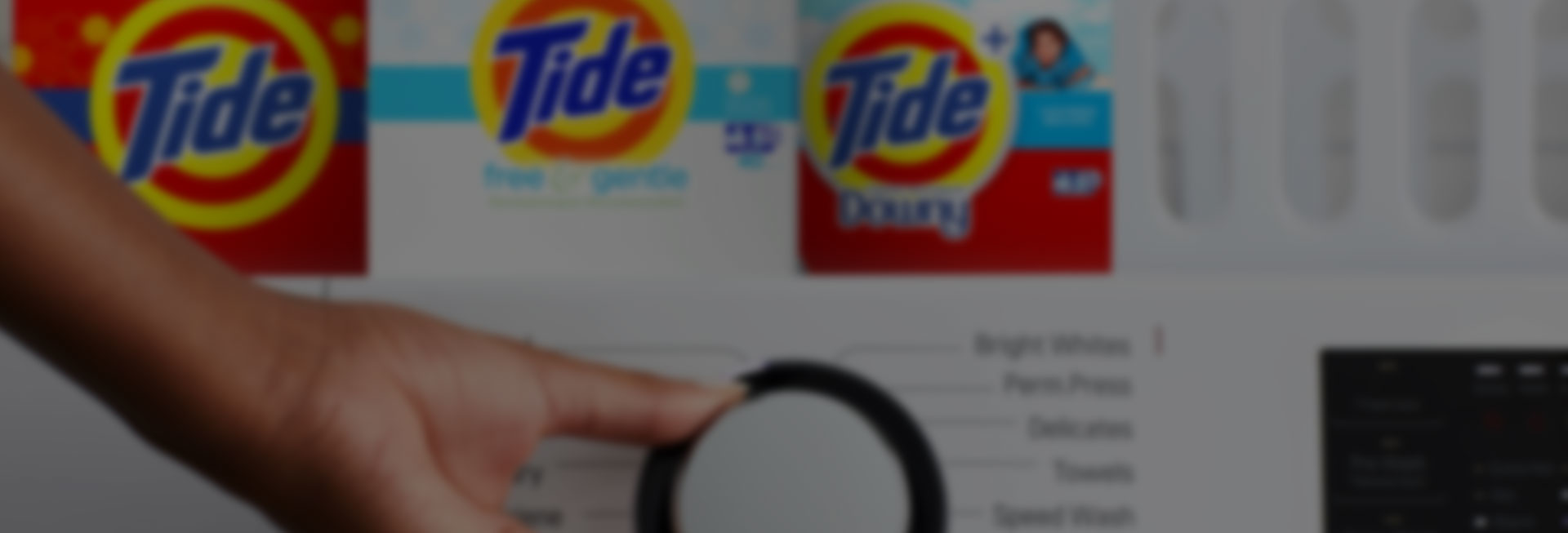 Tide powder detergent products on a washing machine